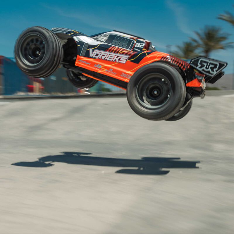 ARRMA ARA3205ST1+SPMXPSS100 1/10 VORTEKS MEGA 550 Brushed 2WD Stadium Truck RTR with Battery &amp; Charger, Orange