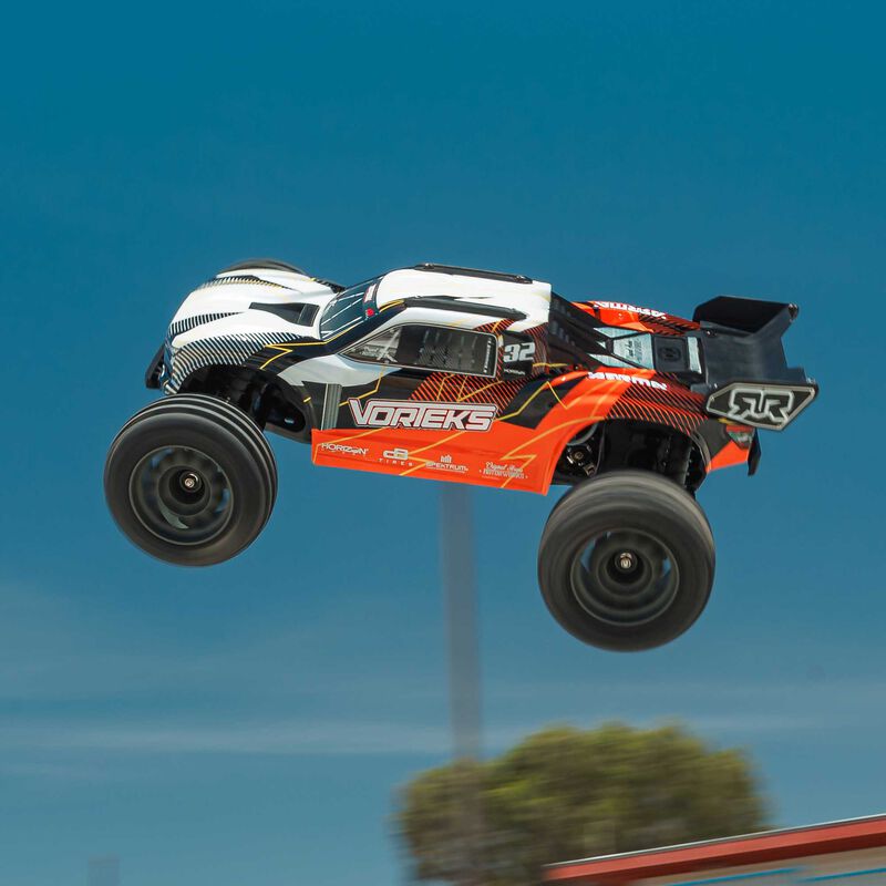 ARRMA ARA3205ST1+SPMXPSS100 1/10 VORTEKS MEGA 550 Brushed 2WD Stadium Truck RTR with Battery &amp; Charger, Orange
