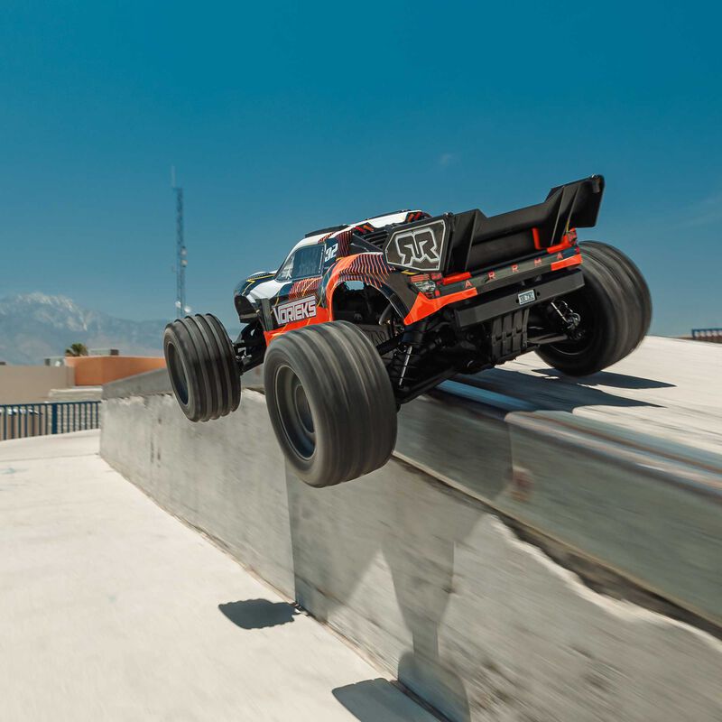 ARRMA ARA3205ST1+SPMXPSS100 1/10 VORTEKS MEGA 550 Brushed 2WD Stadium Truck RTR with Battery &amp; Charger, Orange