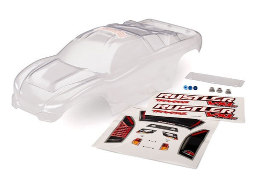 Traxxas 3714 - Body Rustler (clear requires painting)/window lights decal sheet/ wing and aluminum hardware (7622647382253)